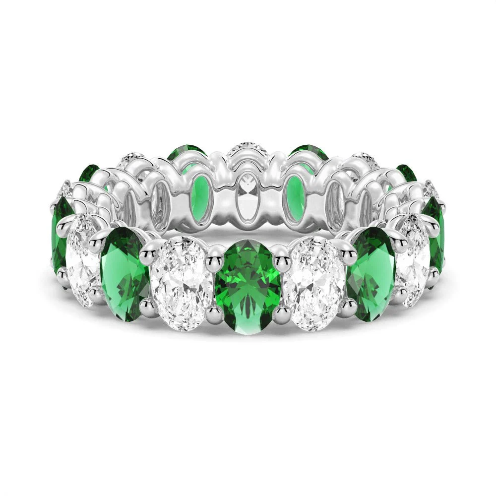 Front view showing alternating emerald green and white sapphire gemstones