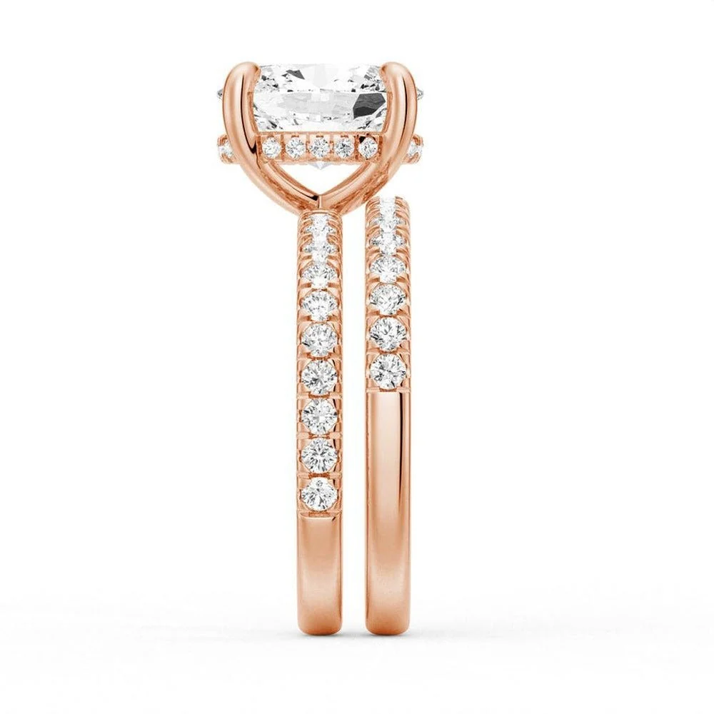 Rose gold oval moissanite bridal set side profile view showing stacked engagement ring and pave band