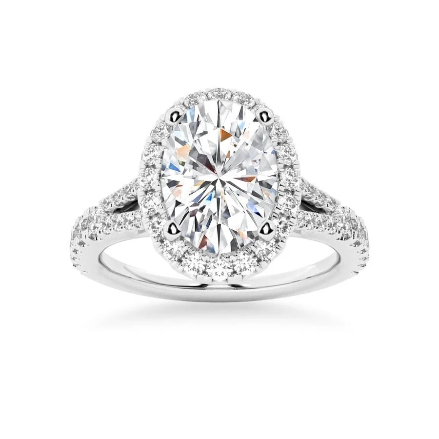 White gold oval moissanite engagement ring top view with sparkling halo and pave split shank-Novelle Vow