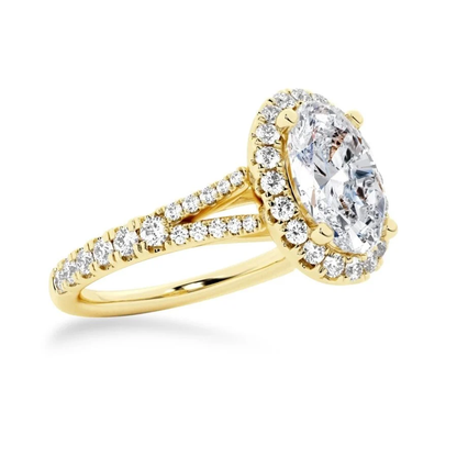 Yellow gold oval moissanite engagement ring 3/4 perspective view with halo and split pavé band