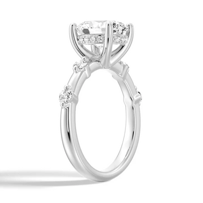 White gold oval moissanite engagement ring 3/4 angle view showing hidden halo basket