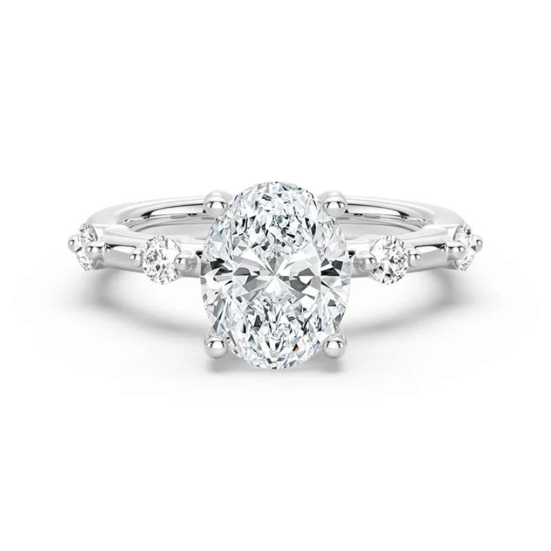 White gold oval moissanite engagement ring top view showcasing spaced accent stones-NOVELLE VOW