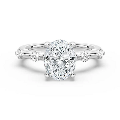 White gold oval moissanite engagement ring top view showcasing spaced accent stones-NOVELLE VOW