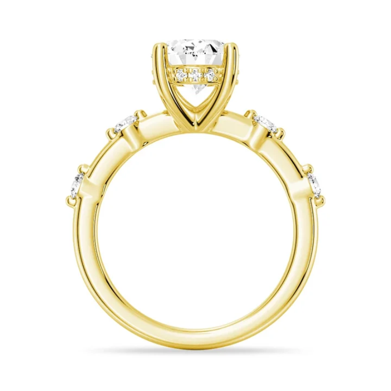 Yellow gold oval moissanite engagement ring direct side profile view with hidden halo and spaced diamond band