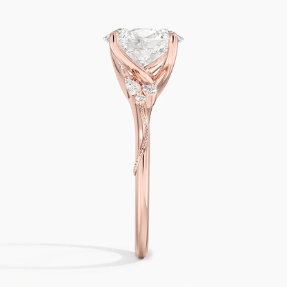 Rose gold oval moissanite engagement ring side view displaying vine branch details