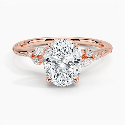 Rose gold oval moissanite engagement ring top view with organic marquise cluster accents