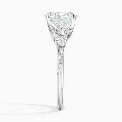 White gold oval moissanite engagement ring side profile showing botanical setting and delicate 1.8mm band