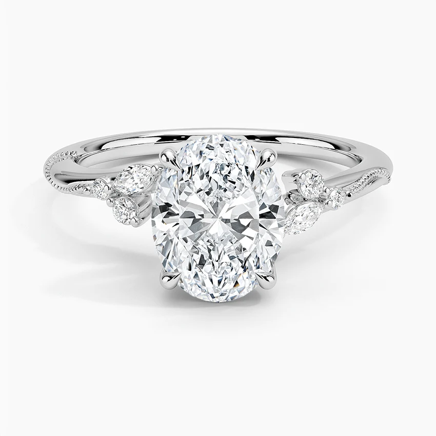 NOVELLE VOW white gold oval moissanite engagement ring top view with floral leaf side stones
