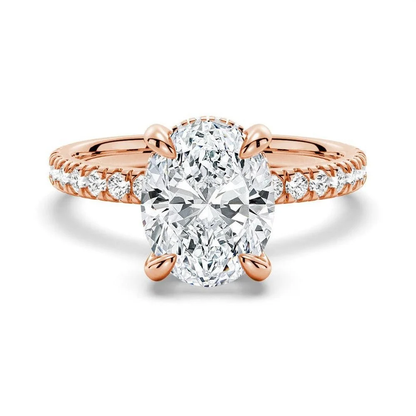 Rose gold oval cut moissanite engagement ring top view with pave band