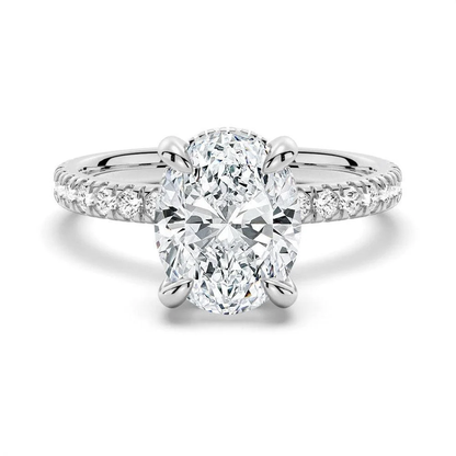 White gold oval cut moissanite engagement ring top view with pave band