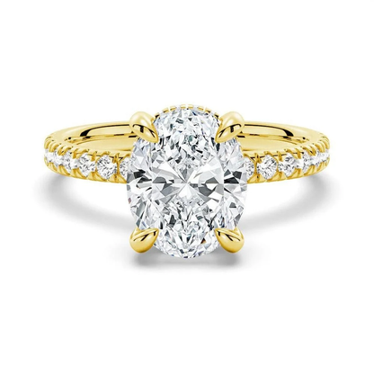 Yellow gold oval cut moissanite engagement ring top view with pave band