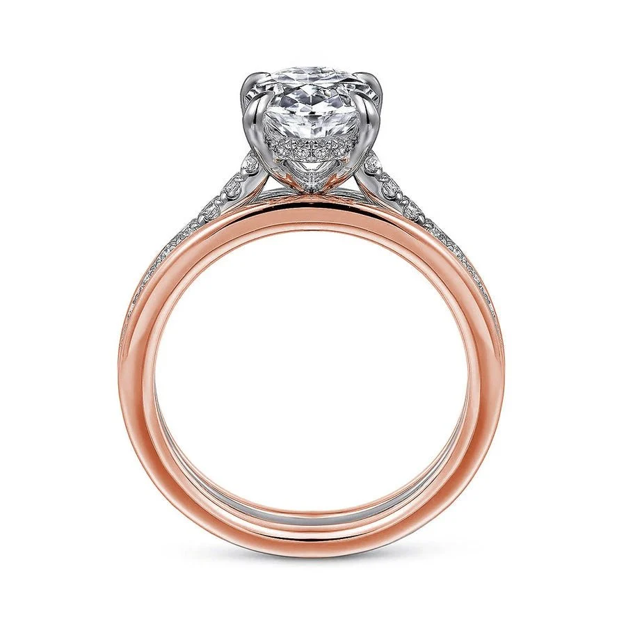 Two-tone rose gold oval moissanite engagement ring direct side profile displaying white gold setting