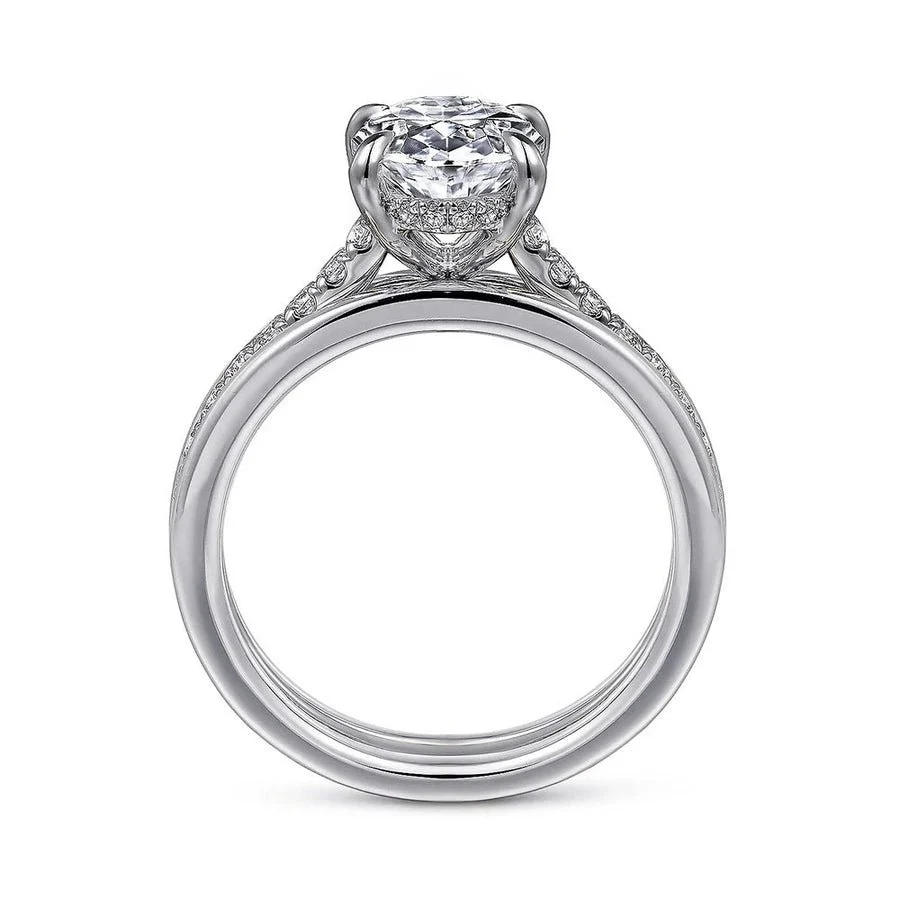 Two-tone white gold oval moissanite engagement ring direct side profile displaying white gold setting