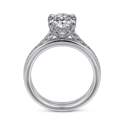 Two-tone white gold oval moissanite engagement ring direct side profile displaying white gold setting