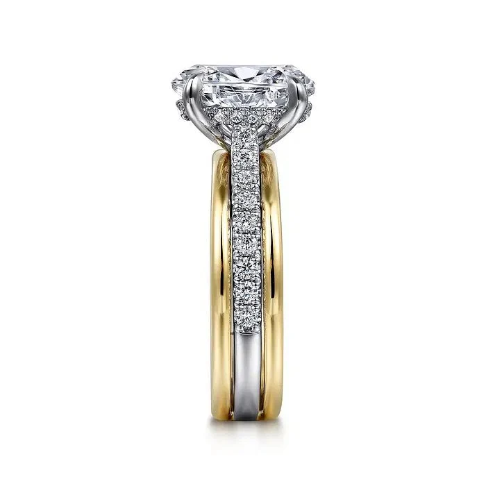 Two-tone yellow gold and white gold oval moissanite engagement ring stacked profile view showing pave shank