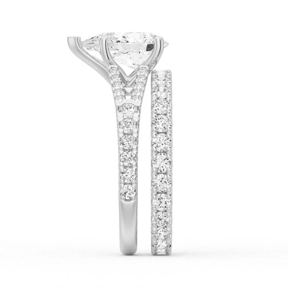 White gold pear moissanite bridal set side profile view showing stacked engagement ring and pave band