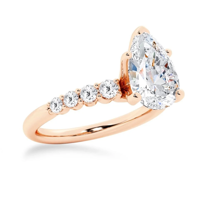 Rose gold pear-cut moissanite engagement ring 3/4 angle view showing shared-prong band setting