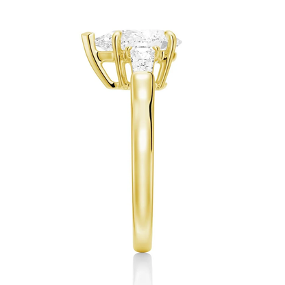 Yellow gold pear moissanite engagement ring side profile showing tapered baguette mount