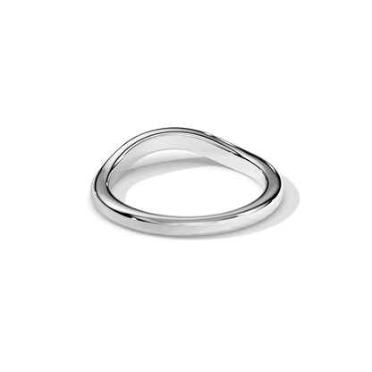 Angled view of white gold plain curved wedding band lying flat