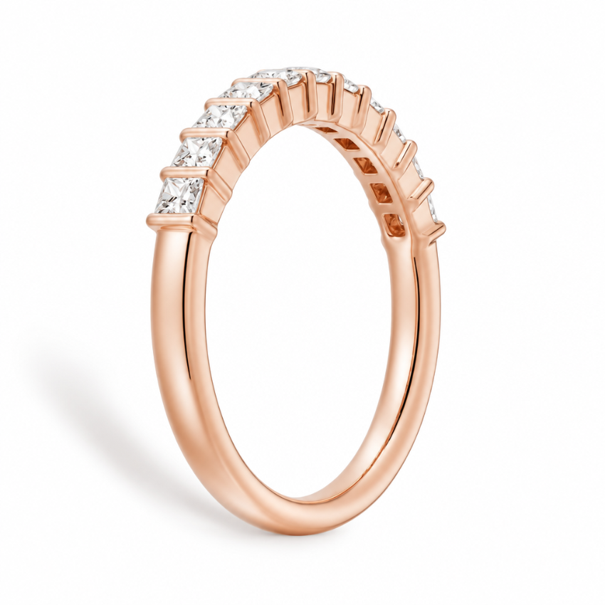 Side profile view of rose gold princess cut moissanite eternity band