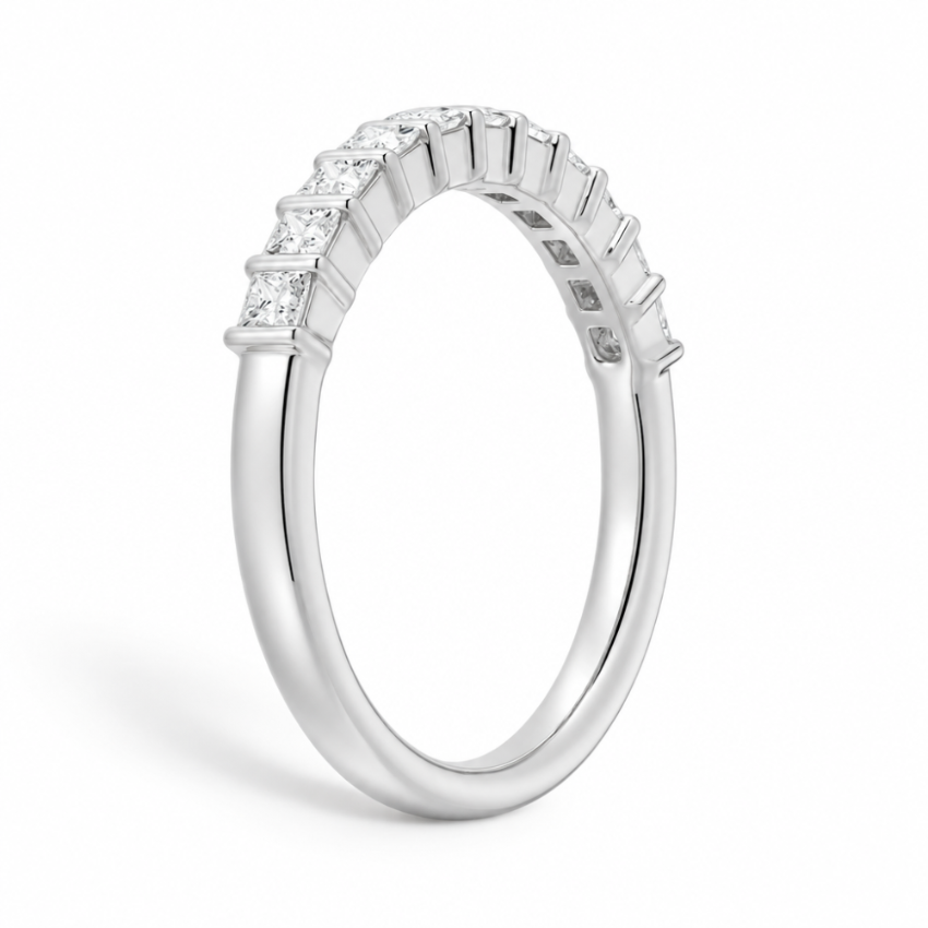 Three quarter angled view of white gold princess cut moissanite wedding band