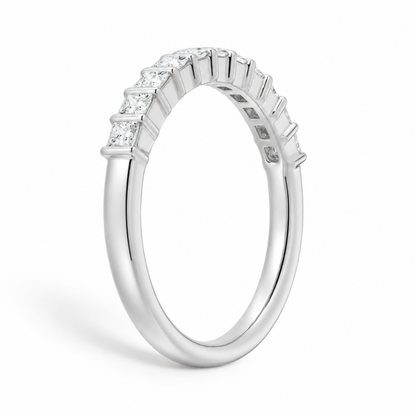 Three quarter angled view of white gold princess cut moissanite wedding band