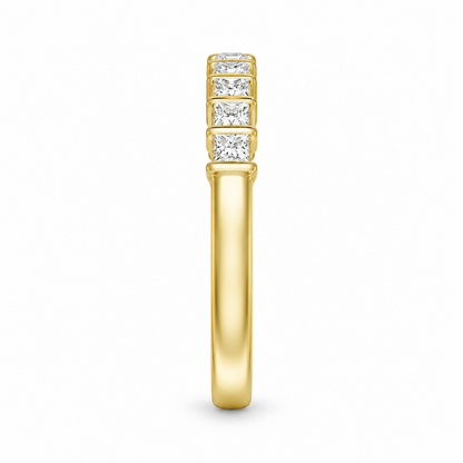 Side thickness view of yellow gold princess cut moissanite eternity band