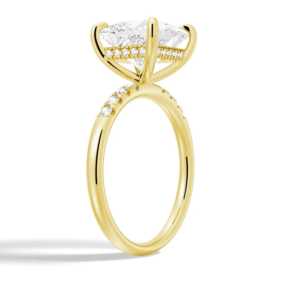 Yellow gold princess-cut moissanite engagement ring 3/4 angle view showing hidden halo setting