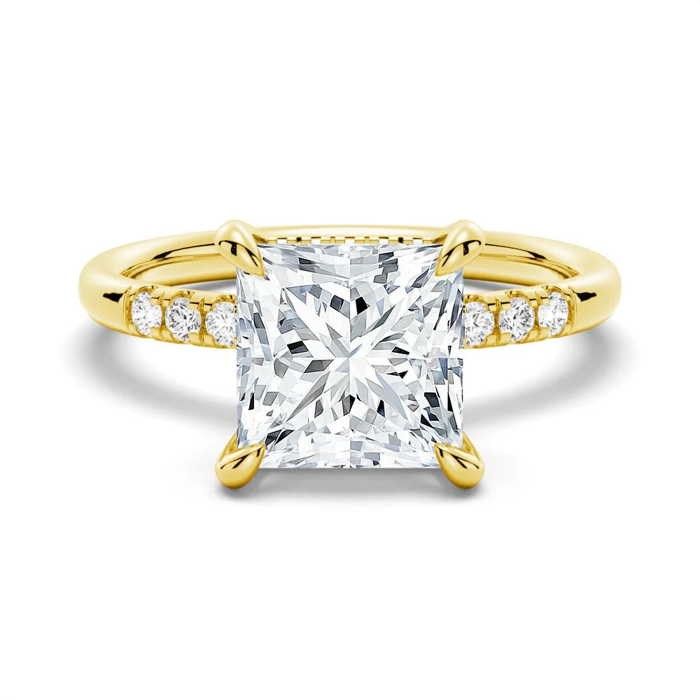 Yellow gold princess-cut moissanite engagement ring top view with sparkling micropave band