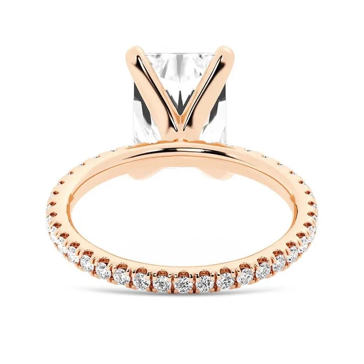 Rose gold 5ct radiant cut moissanite engagement ring direct side view showing basket strut prongs