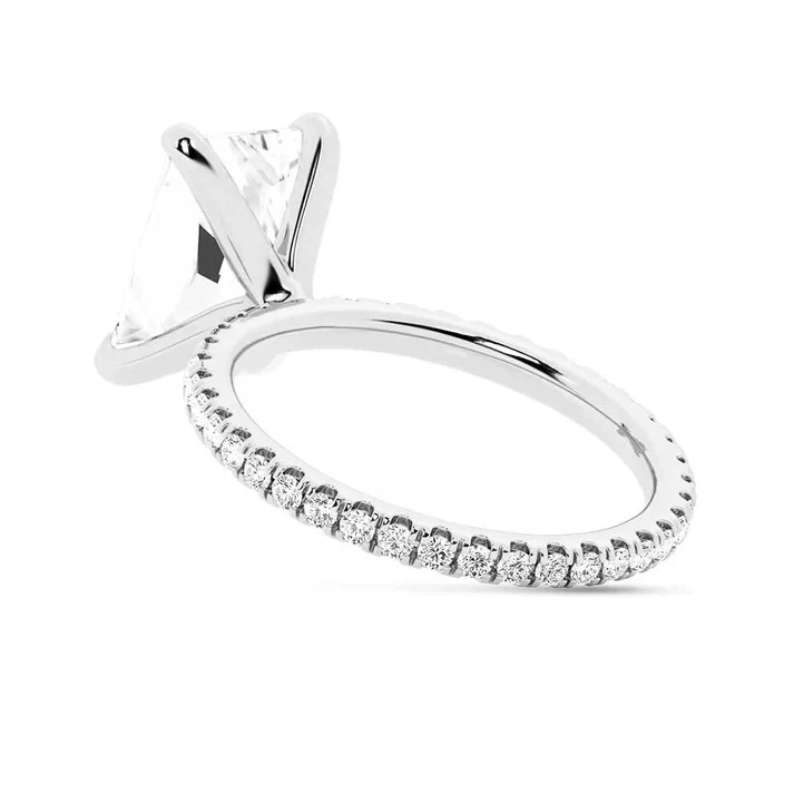 White gold 5ct radiant cut moissanite engagement ring tilted side profile view showing prong setting