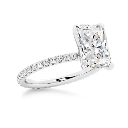 White gold 5ct radiant cut moissanite engagement ring 3/4 side perspective view showing eternity pave band