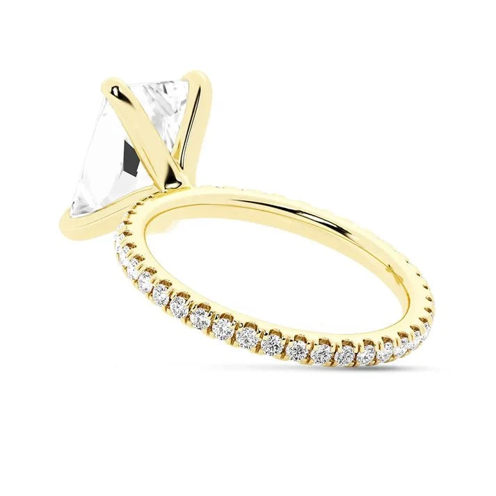 Yellow gold 5ct radiant cut moissanite engagement ring tilted side profile view showing prong setting
