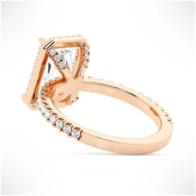 Rose gold radiant cut moissanite halo engagement ring tilted perspective view with pave band
