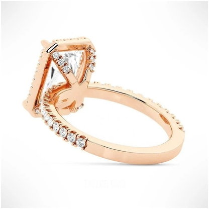 Rose gold radiant cut moissanite halo engagement ring tilted perspective view with pave band