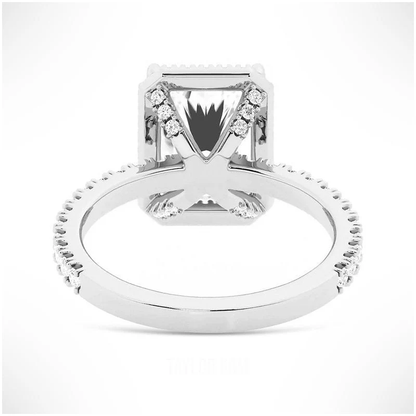 White gold radiant cut moissanite halo engagement ring side view showing pave studded basket prongs