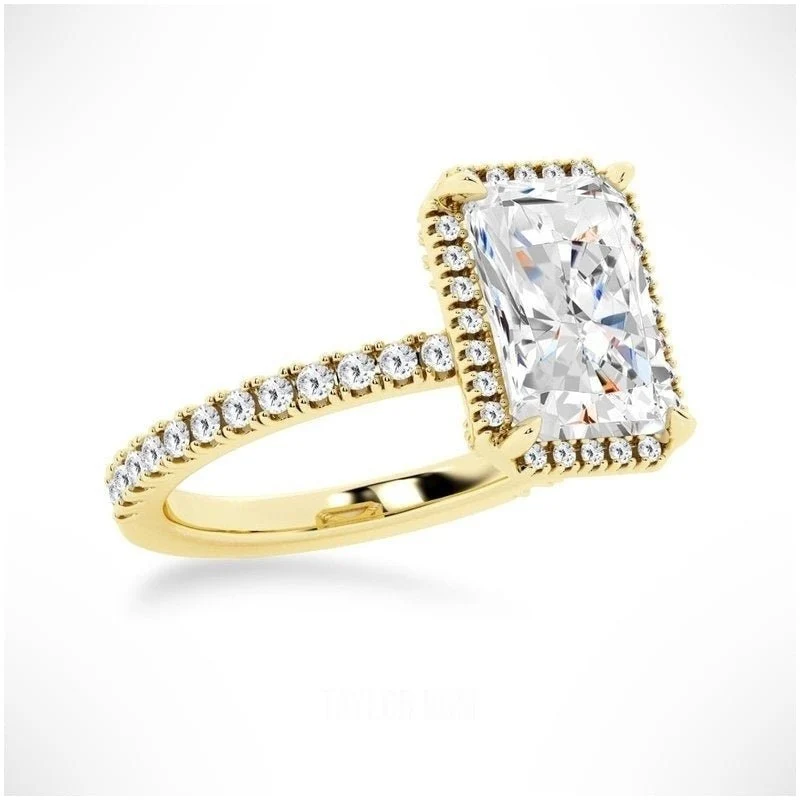 Yellow gold radiant cut moissanite halo engagement ring 3/4 side low angle view showing basket details