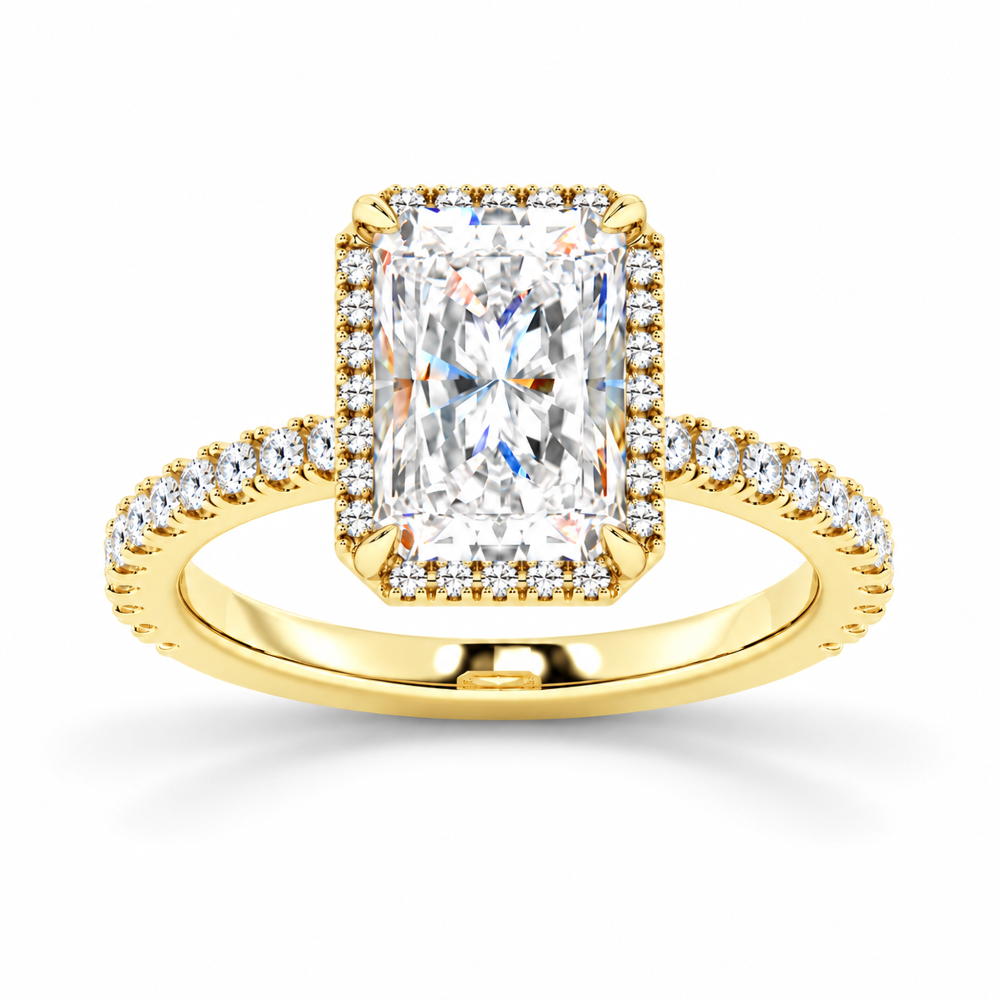 Yellow gold radiant cut moissanite halo engagement ring top view with pave diamond band