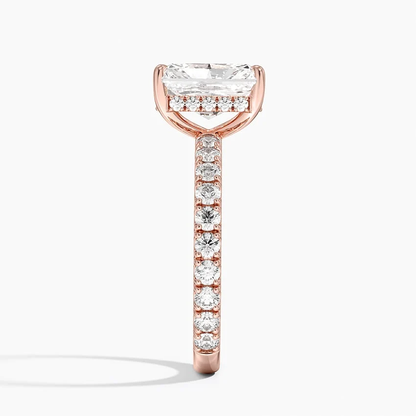 Rose gold radiant cut moissanite engagement ring direct side profile view showing hidden halo basket