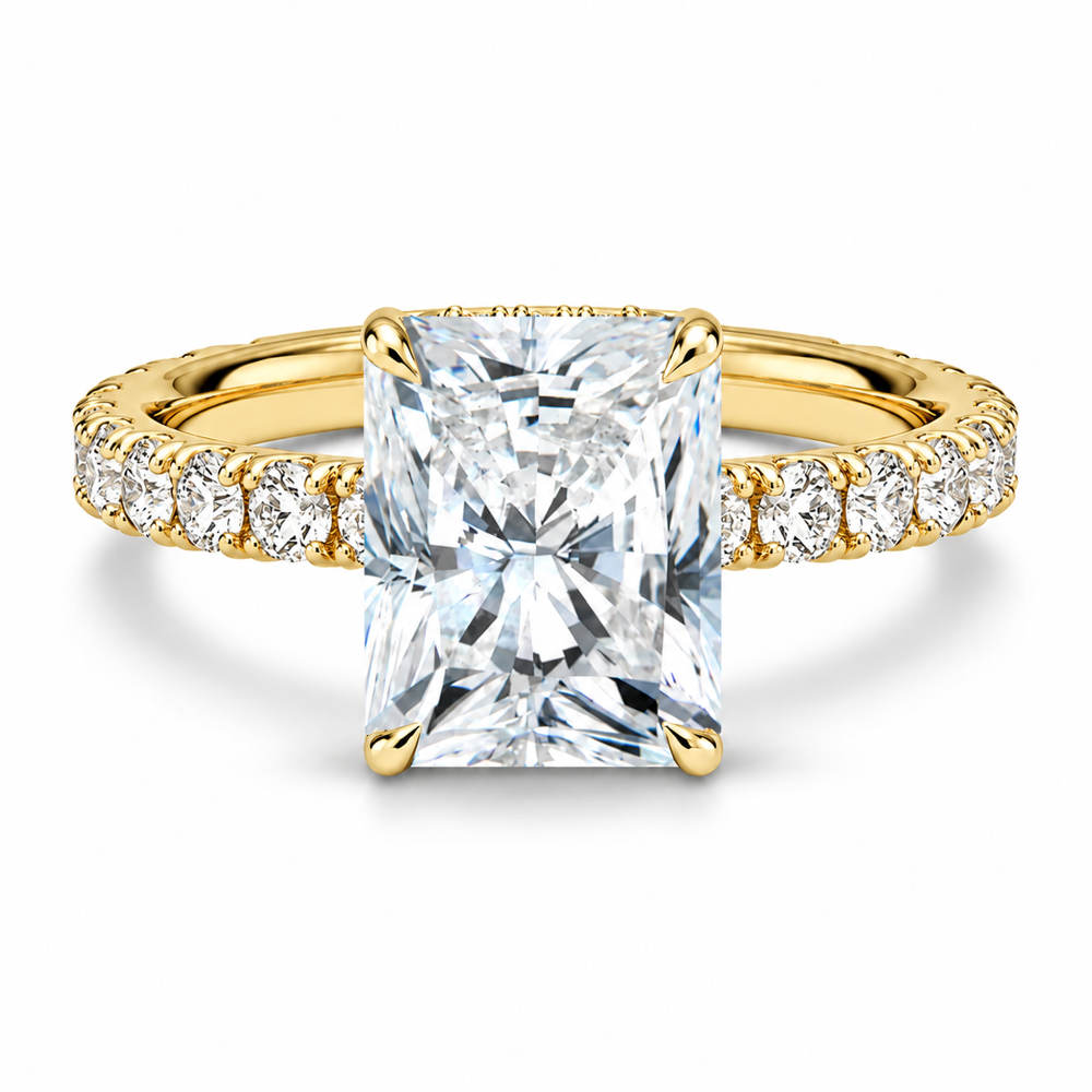 Yellow gold radiant cut moissanite engagement ring top view with scalloped pave band