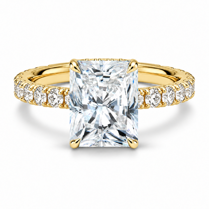 Yellow gold radiant cut moissanite engagement ring top view with scalloped pave band