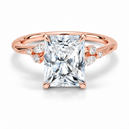 Rose gold radiant cut moissanite engagement ring top view with delicate nature inspired cluster accents