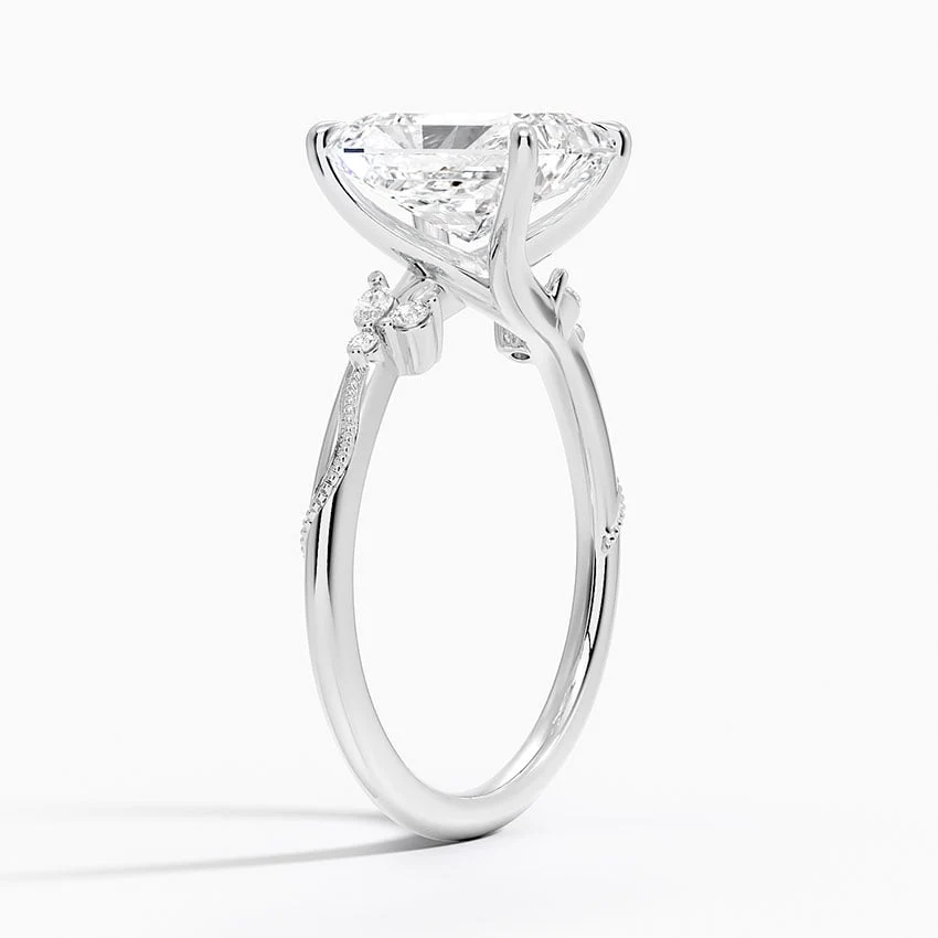 White gold radiant cut moissanite engagement ring 3/4 side perspective view showing nature inspired organic setting