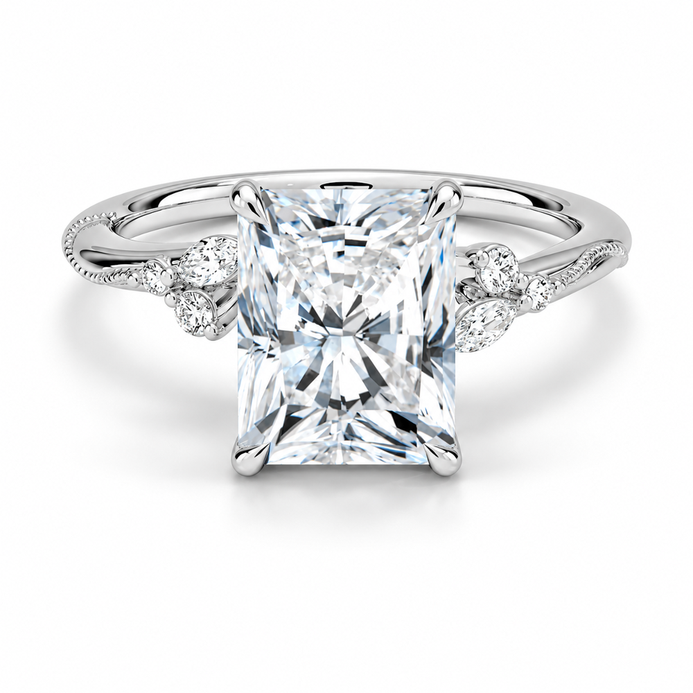 White gold radiant cut moissanite engagement ring top view with delicate nature inspired cluster accents-Novelle Vow