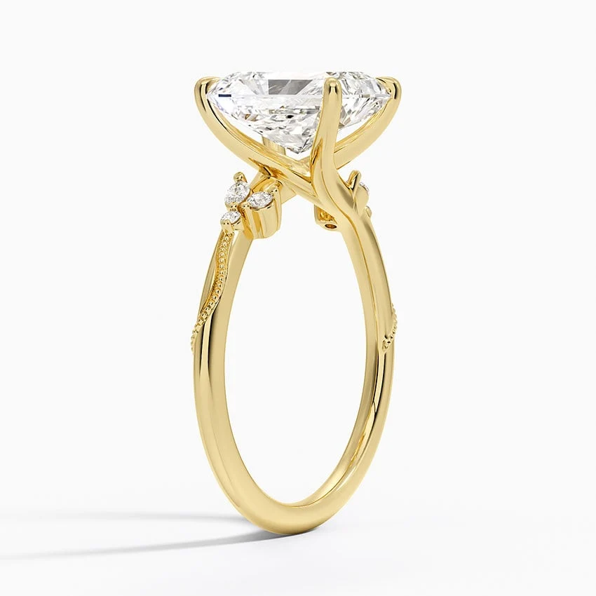 Yellow gold radiant cut moissanite engagement ring 3/4 side perspective view showing nature inspired organic setting