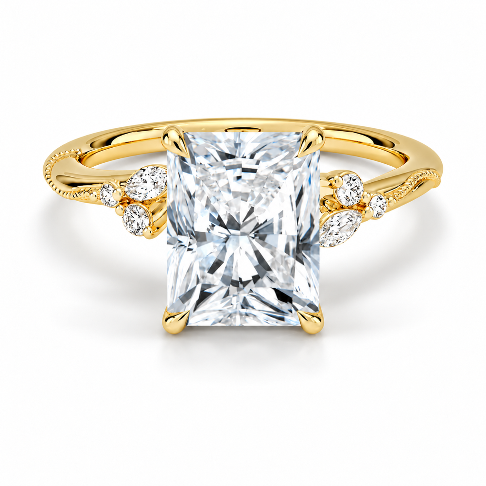 Yellow gold radiant cut moissanite engagement ring top view with delicate nature inspired cluster accents