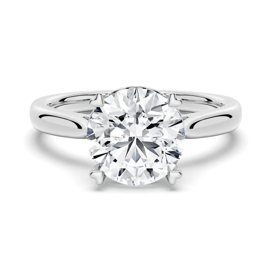 Round Brilliant Cut Moissanite Engagement Ring – Heart Shaped Prongs - Novelle Vow