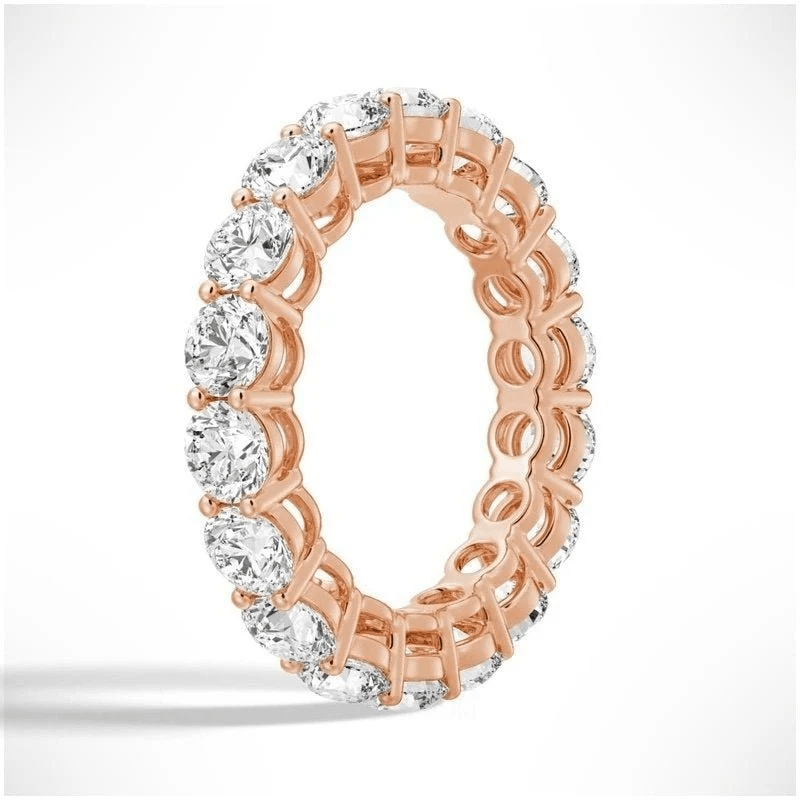 Angled profile view of Round Cut Moissanite Full Eternity Band with Shared Prong Setting in Rose Gold - Novelle Vow