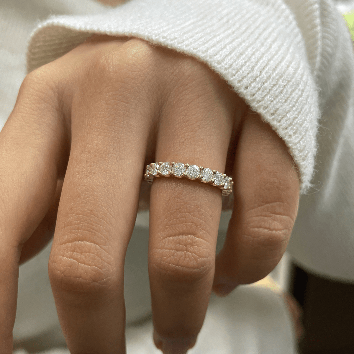 Round Cut Moissanite Full Eternity Band with Shared Prong Setting in White Gold on hand styling- Novelle Vow