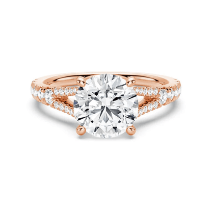 Rose gold round brilliant cut moissanite engagement ring with split shank and pave accents